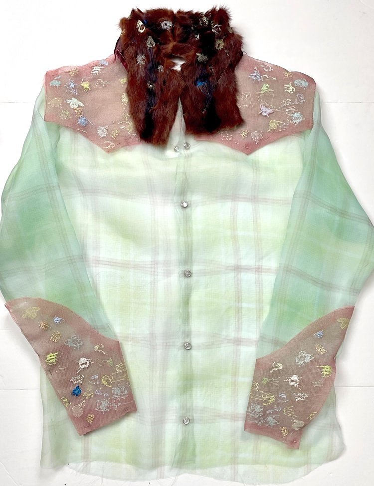 A western shirt of pale green plaid organza with pink embroidered yokes and cuffs, snaps, and a collar of reclaimed brown fur.