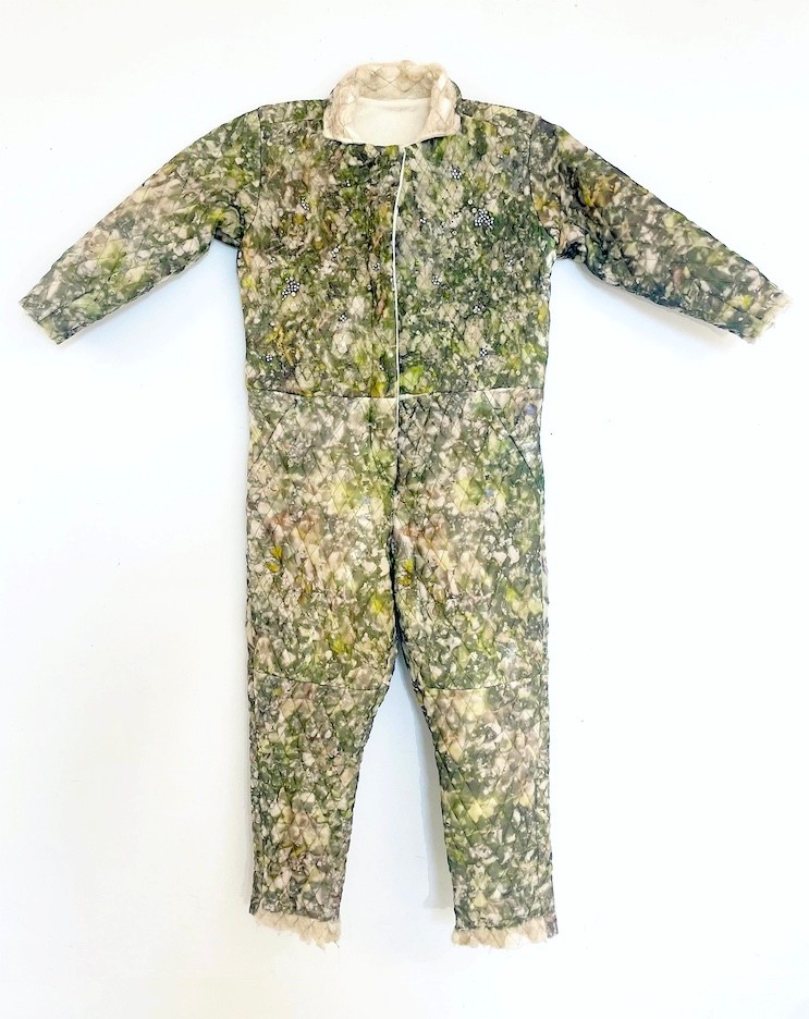 A quilted jumpsuit in mottled green and cream silk organza, embroidered with rhinestones and beads.