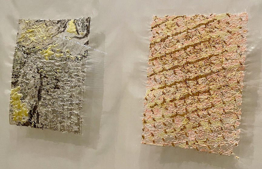Two digitally embroidered samples in detail: one yellow and grey, one pale peach in diagonal bands.