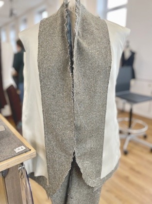 The body lining basted into the jacket.